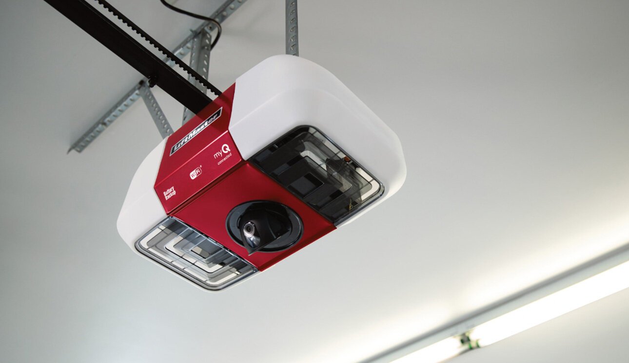 a professional technician from Bexley Garage Door Repair expertly replacing a garage door opener in a residential setting, with various tools and equipment visible.
