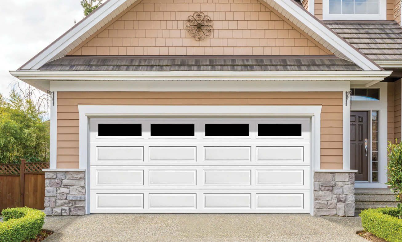 Professional uniformed technician working on residential garage door repair in Bexley, Ohio
